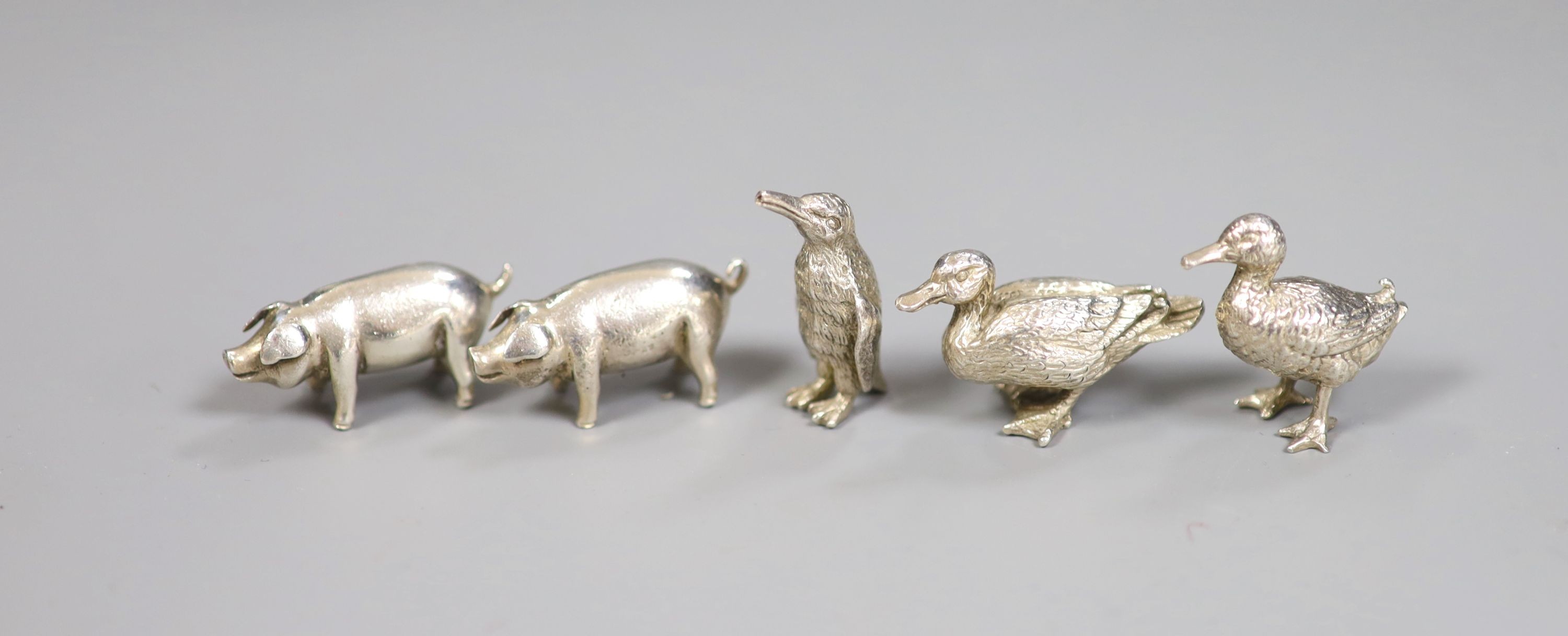 Five modern miniature silver model animals including two pigs by Simon J Beer, London, 1991, two ducks and a penguin, tallest 3cm, 87 grams.